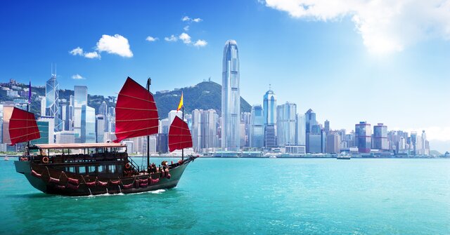 Hong Kong cuts hotel quarantine period for arrivals